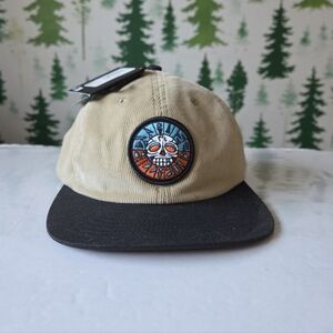 Billabong Beige and Black Snapback with Vibrant Skull Patch